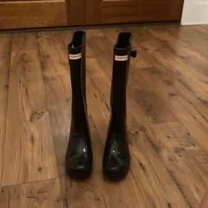 Tall black hunter boots